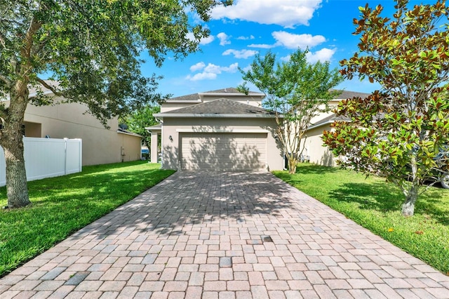 15613 Camp Dubois Cres, Winter Garden, FL 34787 - view of front of house with decorative driveway, a garage, and stucco siding