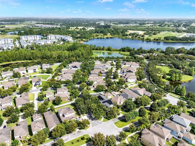 15613 Camp Dubois Cres, Winter Garden, FL 34787 - aerial view of residential area featuring a nearby body of water and a tree filled landscape