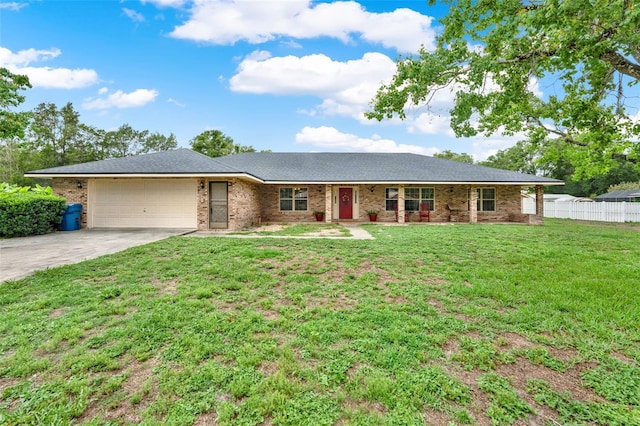 1778 Woodcrest Ln, Deland, FL 32720 - single story home featuring a garage, concrete driveway, and brick siding