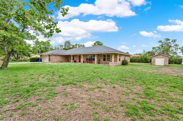 1778 Woodcrest Ln, Deland, FL 32720 - view of front of home with a shed, a front lawn, and a detached garage