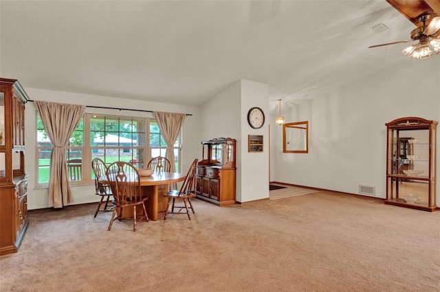 1778 Woodcrest Ln, Deland, FL 32720 - dining area featuring light colored carpet, a ceiling fan, vaulted ceiling, and a textured ceiling