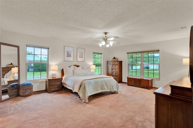 1778 Woodcrest Ln, Deland, FL 32720 - bedroom featuring light carpet, a ceiling fan, and a textured ceiling