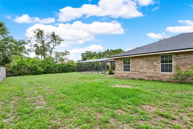 1778 Woodcrest Ln, Deland, FL 32720 - fenced backyard with glass enclosure