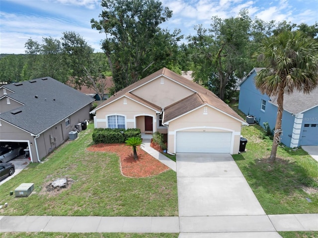 917 Dekleva Dr, Apopka, FL 32712 - view of front of home with a garage, concrete driveway, stucco siding, and a front yard