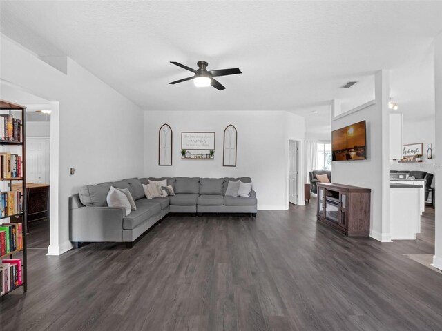 917 Dekleva Dr, Apopka, FL 32712 - living area with dark wood finished floors, a ceiling fan, and baseboards