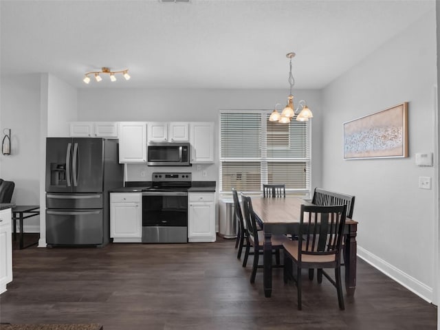 917 Dekleva Dr, Apopka, FL 32712 - dining space featuring a chandelier, baseboards, and dark wood-style floors