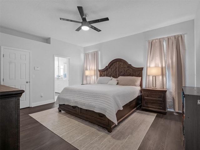 917 Dekleva Dr, Apopka, FL 32712 - bedroom with dark wood-type flooring, baseboards, a ceiling fan, and connected bathroom