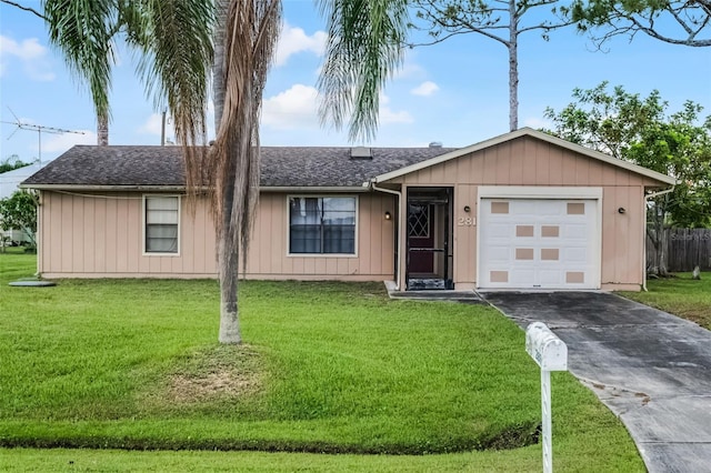 281 NE Greenbrier Ave, Port St Lucie, FL 34983 - ranch-style house featuring asphalt driveway, a front lawn, an attached garage, and roof with shingles