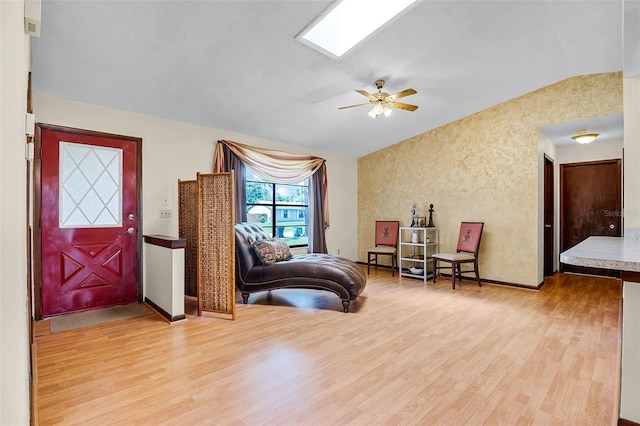 281 NE Greenbrier Ave, Port St Lucie, FL 34983 - sitting room with light wood-type flooring, a ceiling fan, and a skylight