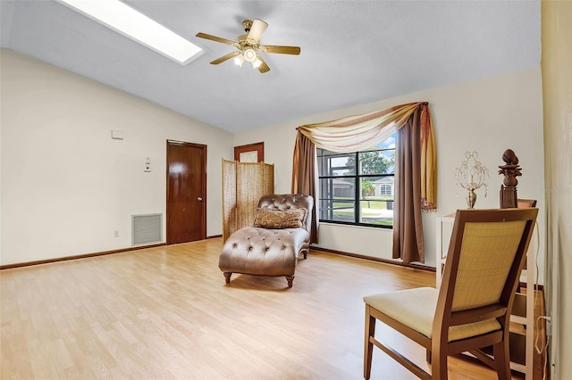 281 NE Greenbrier Ave, Port St Lucie, FL 34983 - sitting room featuring ceiling fan, light wood-type flooring, and lofted ceiling