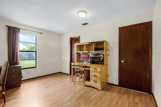 281 NE Greenbrier Ave, Port St Lucie, FL 34983 - office with light wood-style flooring and a textured ceiling