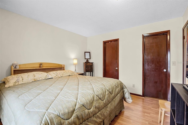 281 NE Greenbrier Ave, Port St Lucie, FL 34983 - bedroom with light wood finished floors and baseboards