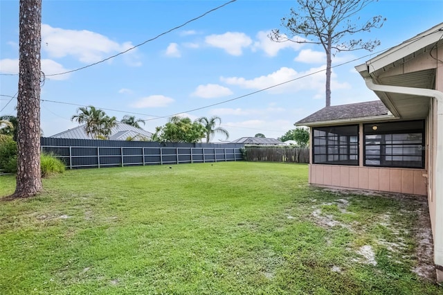 281 NE Greenbrier Ave, Port St Lucie, FL 34983 - fenced backyard featuring a sunroom