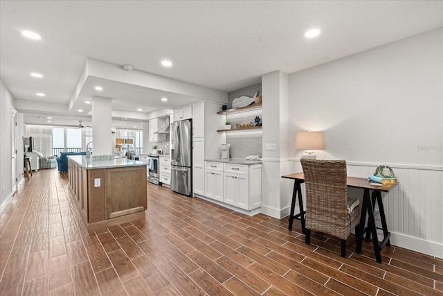 4621 S Atlantic Ave Unit 7202, Port Orange, FL 32127 - kitchen with stainless steel appliances, open shelves, light stone countertops, white cabinets, and dark wood finished floors