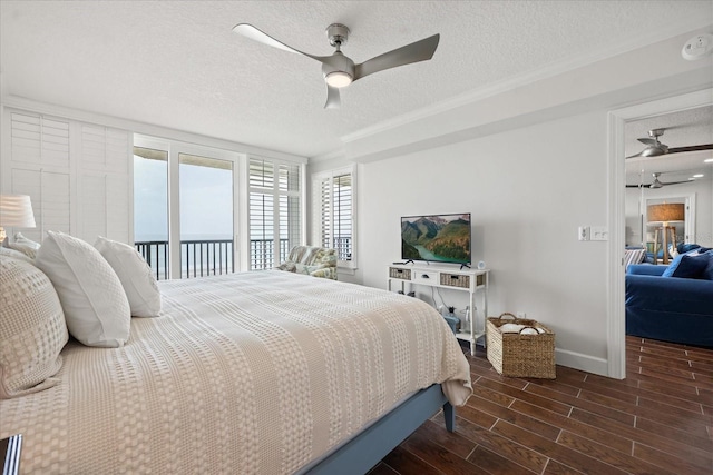 4621 S Atlantic Ave Unit 7202, Port Orange, FL 32127 - bedroom featuring a textured ceiling, dark wood-style flooring, baseboards, ceiling fan, and access to exterior