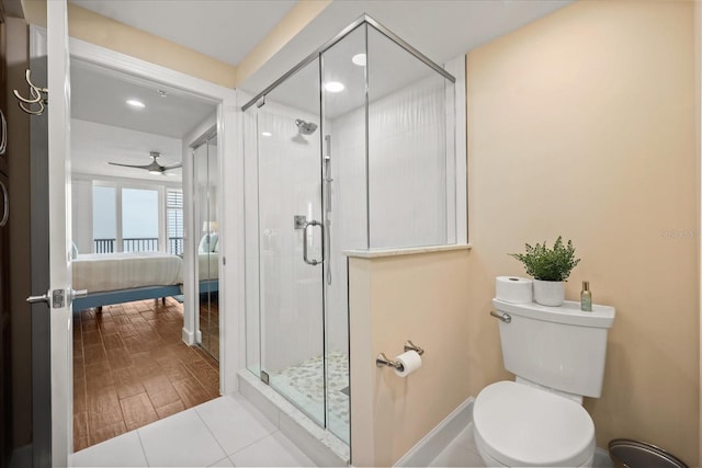 4621 S Atlantic Ave Unit 7202, Port Orange, FL 32127 - ensuite bathroom with a stall shower, toilet, ceiling fan, recessed lighting, and wood finished floors