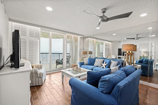 4621 S Atlantic Ave Unit 7202, Port Orange, FL 32127 - living room featuring ceiling fan, a textured ceiling, wood finished floors, and recessed lighting