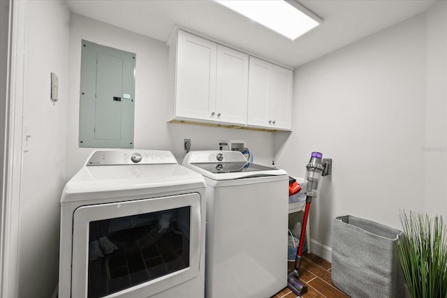 4621 S Atlantic Ave Unit 7202, Port Orange, FL 32127 - laundry area featuring electric panel, washer and clothes dryer, cabinet space, dark wood-style floors, and baseboards