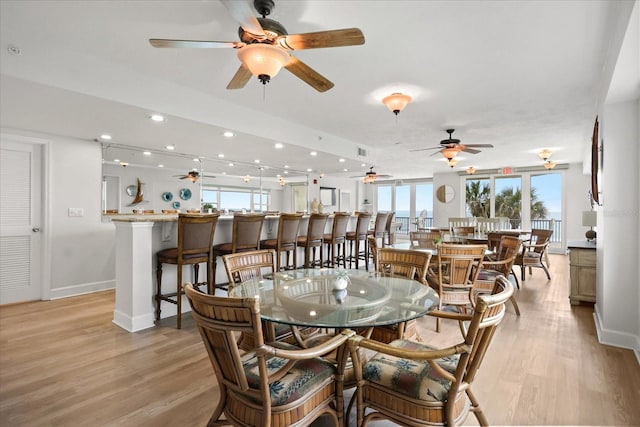 4621 S Atlantic Ave Unit 7202, Port Orange, FL 32127 - dining area featuring ceiling fan, light wood-style flooring, baseboards, a dry bar, and recessed lighting