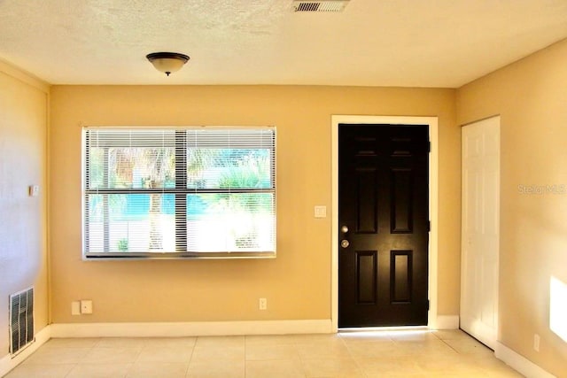 425 Walnut St, Daytona Beach, FL 32114 - entrance foyer featuring baseboards and light tile patterned floors