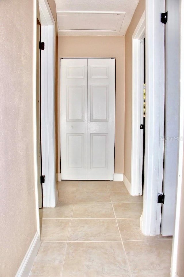425 Walnut St, Daytona Beach, FL 32114 - corridor featuring light tile patterned flooring and baseboards