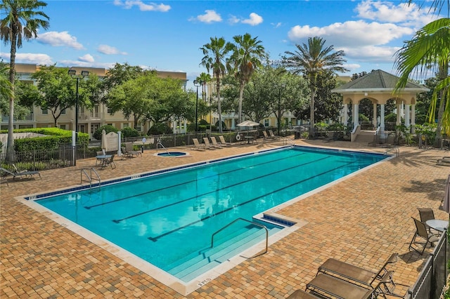 7509 Mourning Dove Cir Unit 302, Reunion, FL 34747 - community pool with a gazebo and a patio