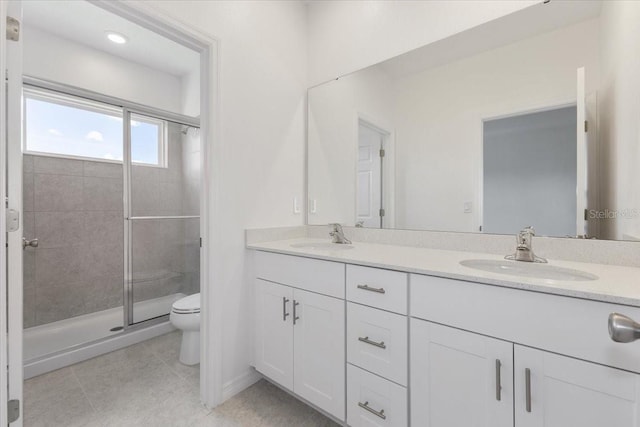1267 Stockwell Ave, Saint Cloud, FL 34771 - full bath with double vanity, a shower stall, and tile patterned flooring