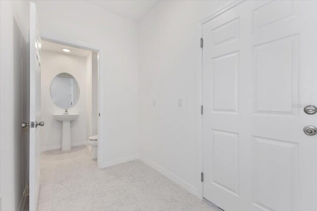 1267 Stockwell Ave, Saint Cloud, FL 34771 - corridor with light colored carpet and recessed lighting
