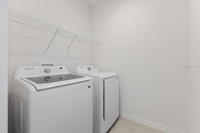 1267 Stockwell Ave, Saint Cloud, FL 34771 - laundry area featuring independent washer and dryer and baseboards