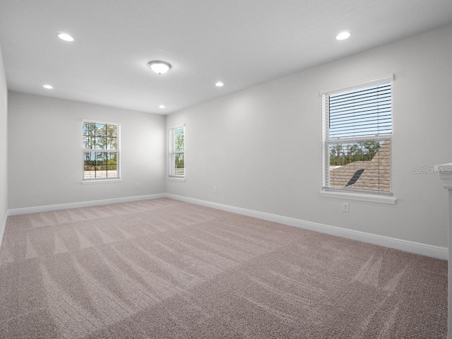 11027 Hollow Bay Dr, Winter Garden, FL 34787 - empty room with recessed lighting, light colored carpet, and baseboards