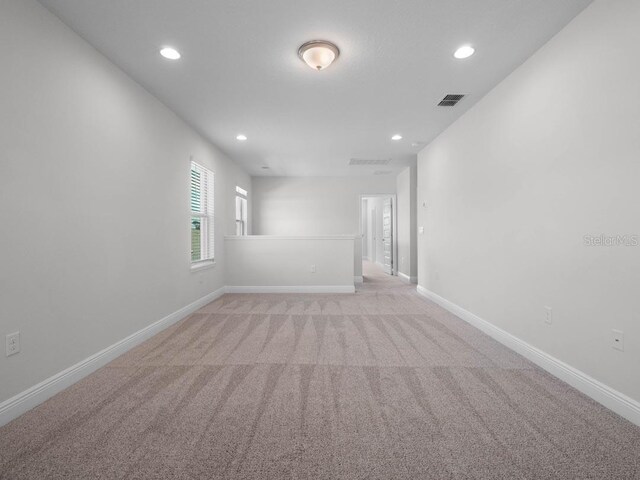 11027 Hollow Bay Dr, Winter Garden, FL 34787 - unfurnished room with light carpet, recessed lighting, and baseboards