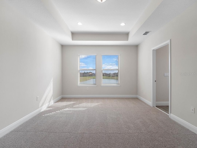 11027 Hollow Bay Dr, Winter Garden, FL 34787 - unfurnished room featuring light colored carpet, a raised ceiling, baseboards, and recessed lighting