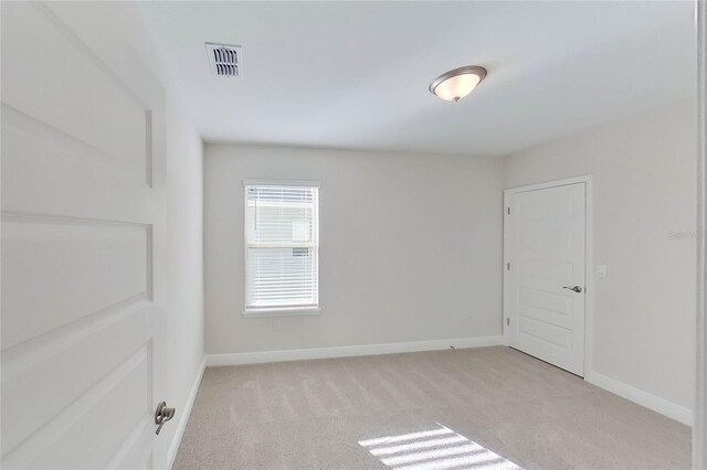 11027 Hollow Bay Dr, Winter Garden, FL 34787 - unfurnished room featuring light carpet and baseboards