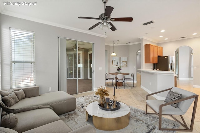 11322 Rapallo Ln, Windermere, FL 34786 - living room with arched walkways, a ceiling fan, light tile patterned floors, ornamental molding, and recessed lighting