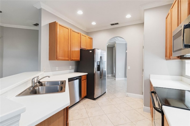 11322 Rapallo Ln, Windermere, FL 34786 - kitchen with appliances with stainless steel finishes, ornamental molding, arched walkways, light countertops, and recessed lighting