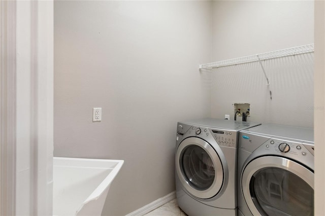 11322 Rapallo Ln, Windermere, FL 34786 - washroom featuring separate washer and dryer and baseboards
