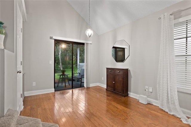 938 Southridge Trl, Altamonte Springs, FL 32714 - unfurnished room with hardwood / wood-style flooring, baseboards, and high vaulted ceiling