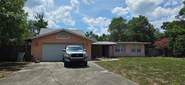 5612 Ridgeway Dr, Orlando, FL 32819 - single story home with driveway, a garage, and stucco siding