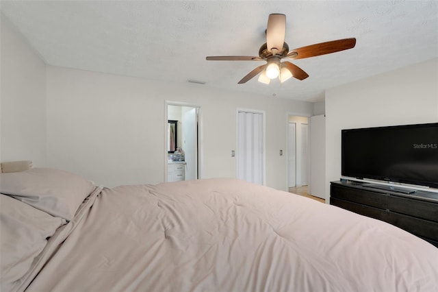 5323 Hansel Ave Unit E14, Orlando, FL 32809 - bedroom with ceiling fan and ensuite bath