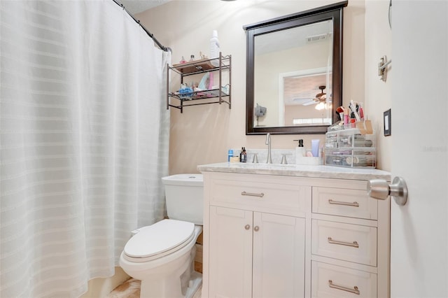 5323 Hansel Ave Unit E14, Orlando, FL 32809 - bathroom with vanity, toilet, and ceiling fan