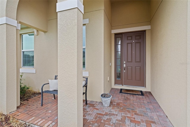 2339 Jernigan Loop, Kissimmee, FL 34746 - doorway to property with stucco siding