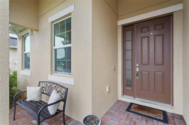 2339 Jernigan Loop, Kissimmee, FL 34746 - view of exterior entry featuring stucco siding