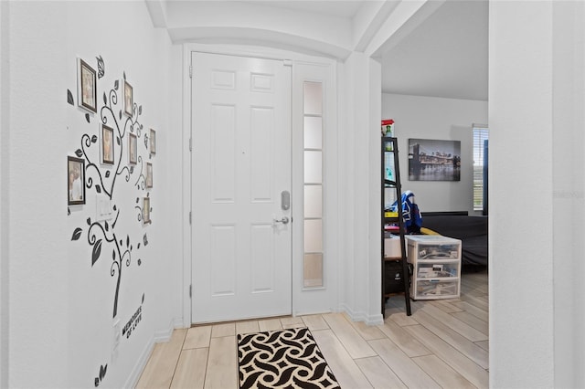 2339 Jernigan Loop, Kissimmee, FL 34746 - entrance foyer featuring wood tiled floors and baseboards
