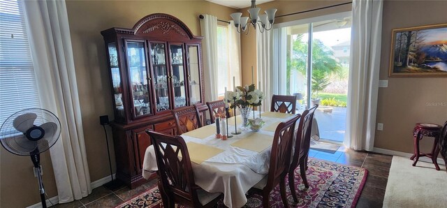 7620 Tangle Rush Dr, Gibsonton, FL 33534 - dining space with a chandelier and baseboards