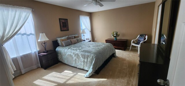 7620 Tangle Rush Dr, Gibsonton, FL 33534 - bedroom featuring light carpet, baseboards, and a ceiling fan