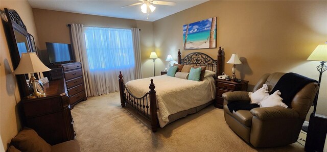 7620 Tangle Rush Dr, Gibsonton, FL 33534 - bedroom featuring light carpet and ceiling fan