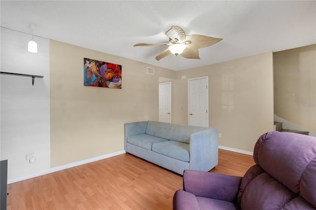 5662 Royal Pine Blvd Unit 24, Orlando, FL 32807 - living room with ceiling fan, light wood-type flooring, and baseboards