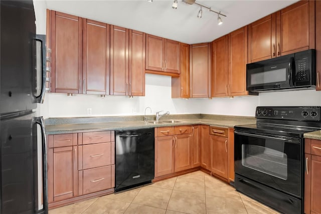5662 Royal Pine Blvd Unit 24, Orlando, FL 32807 - kitchen with black appliances, a sink, light tile patterned flooring, track lighting, and brown cabinetry
