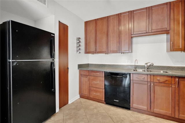 5662 Royal Pine Blvd Unit 24, Orlando, FL 32807 - kitchen featuring black appliances, a sink, light tile patterned flooring, brown cabinetry, and dark countertops