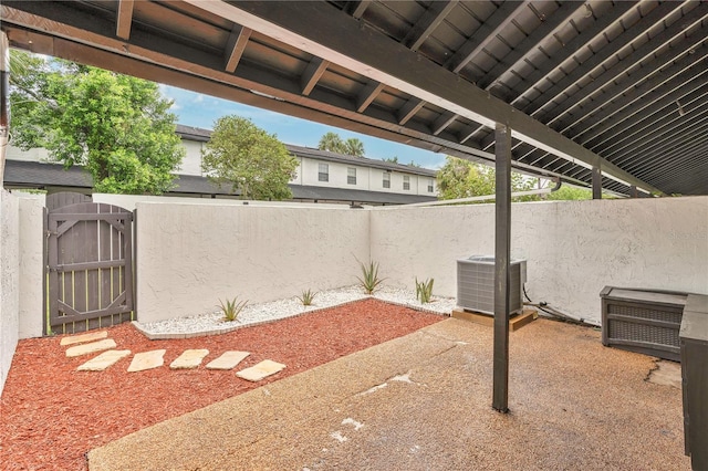 5662 Royal Pine Blvd Unit 24, Orlando, FL 32807 - fenced backyard featuring central AC unit, a gate, and a patio
